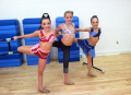 Kendall, Chloe, and Maddie stretching before their solos (2013)